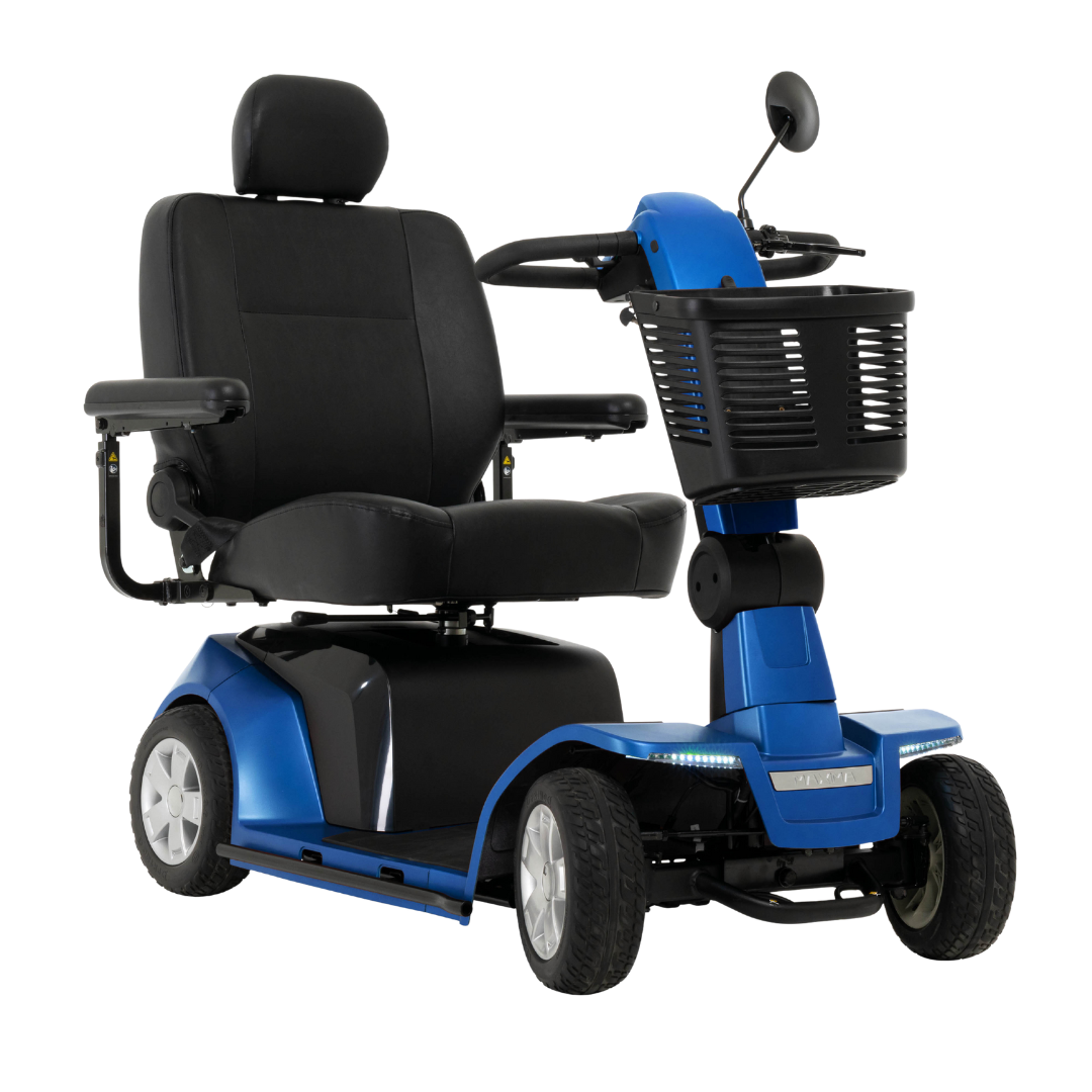 The Pride Mobility Maxima 4-Wheel Bariatric Scooter features a blue and black design, padded seat with armrests and headrest, handlebar with rearview mirror, front basket, four wheels, and an LED lighting package for visibility.